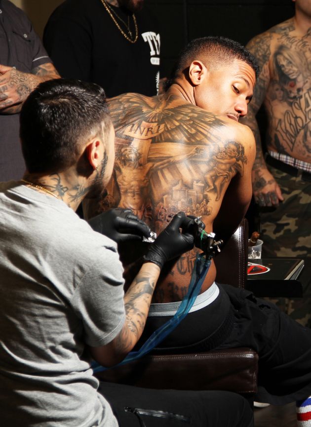 Check Out Nick Cannon’s Tattoo on His Back and His Other